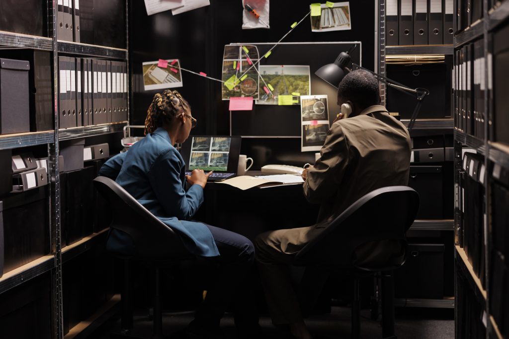 Negligent security injury lawyer reviewing surveillance footage and incident reports to secure compensation for victims.