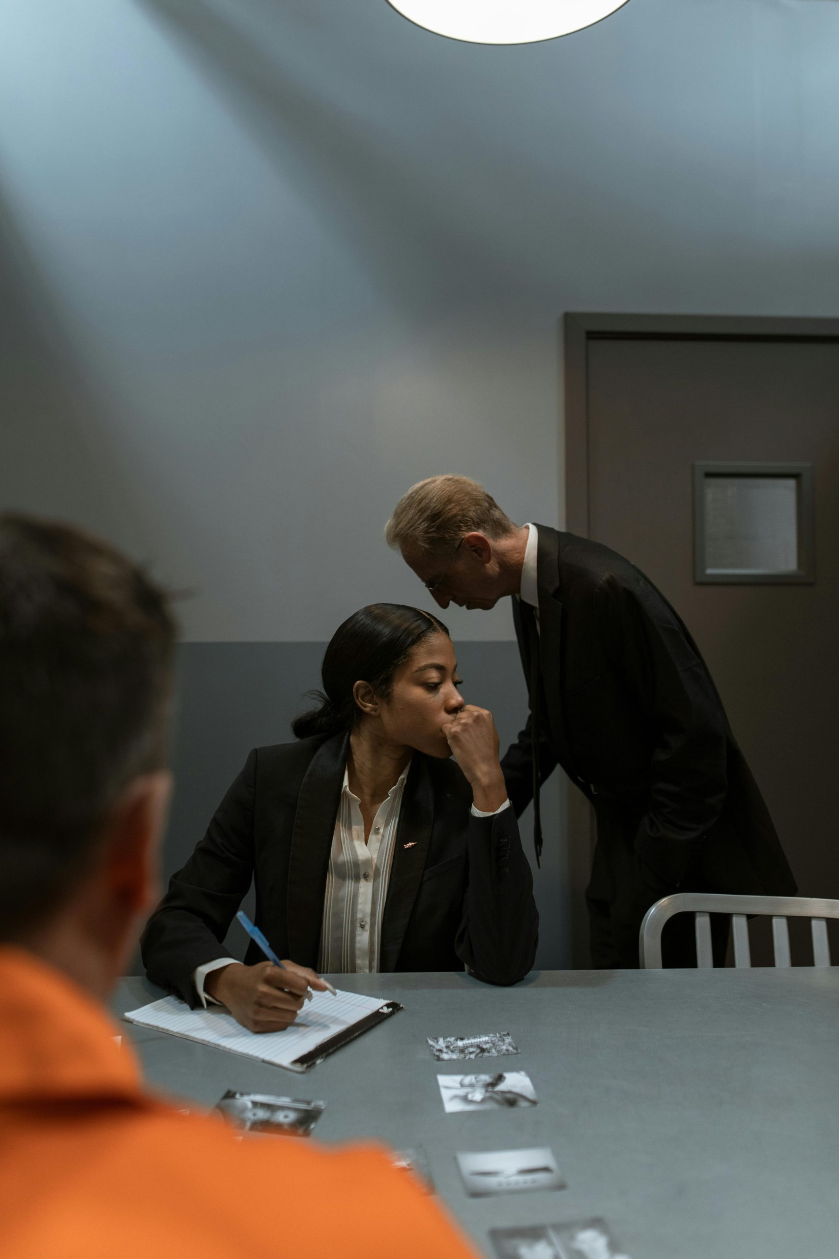 Attorney reviewing evidence after a police car accident to help a client recover compensation.