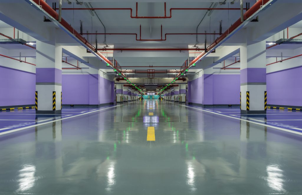 Attorney reviewing evidence and documentation for a parking lot injury case with a client.