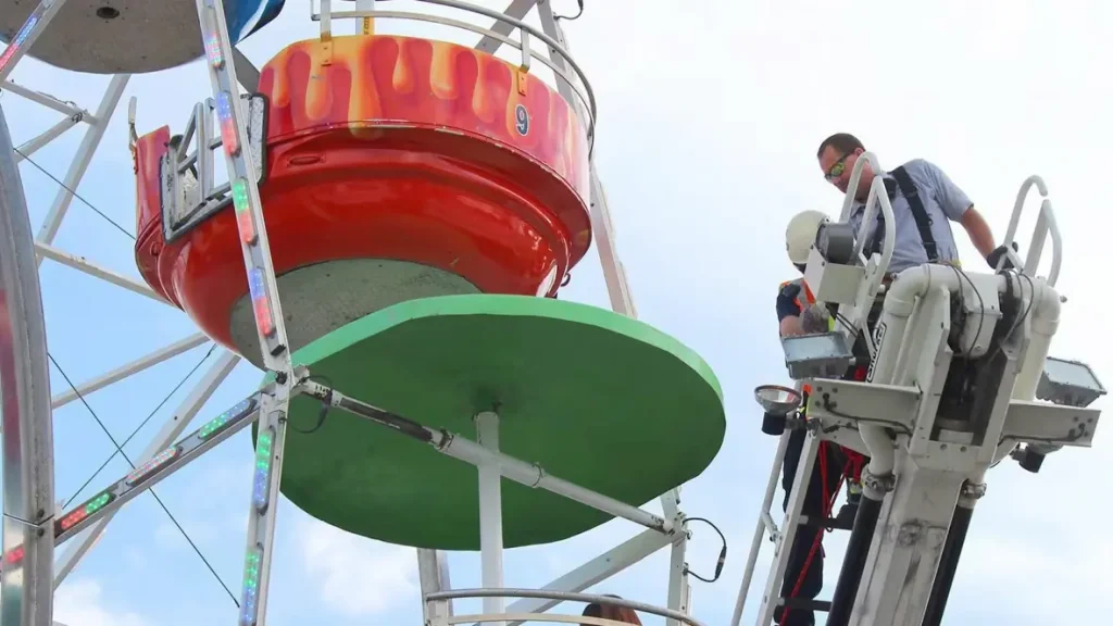 Safety restraints and ride controls being examined after a park injury.